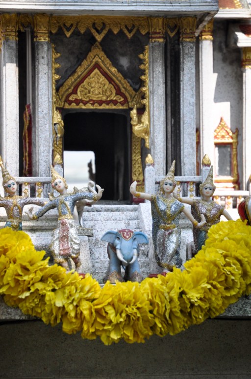 Every house and business had a shrine fully decked out with flowers and food.