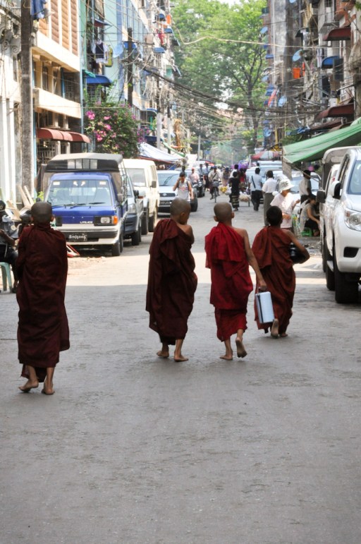 The young Buddhists here wear a dark maroon robe, while in Laos they wear bright orange. I was told it's tradition.