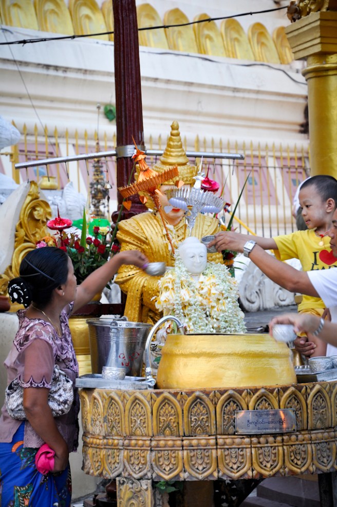 I'm not exactly sure what the significance of pouring water of the Buddha means, but everyone did it...